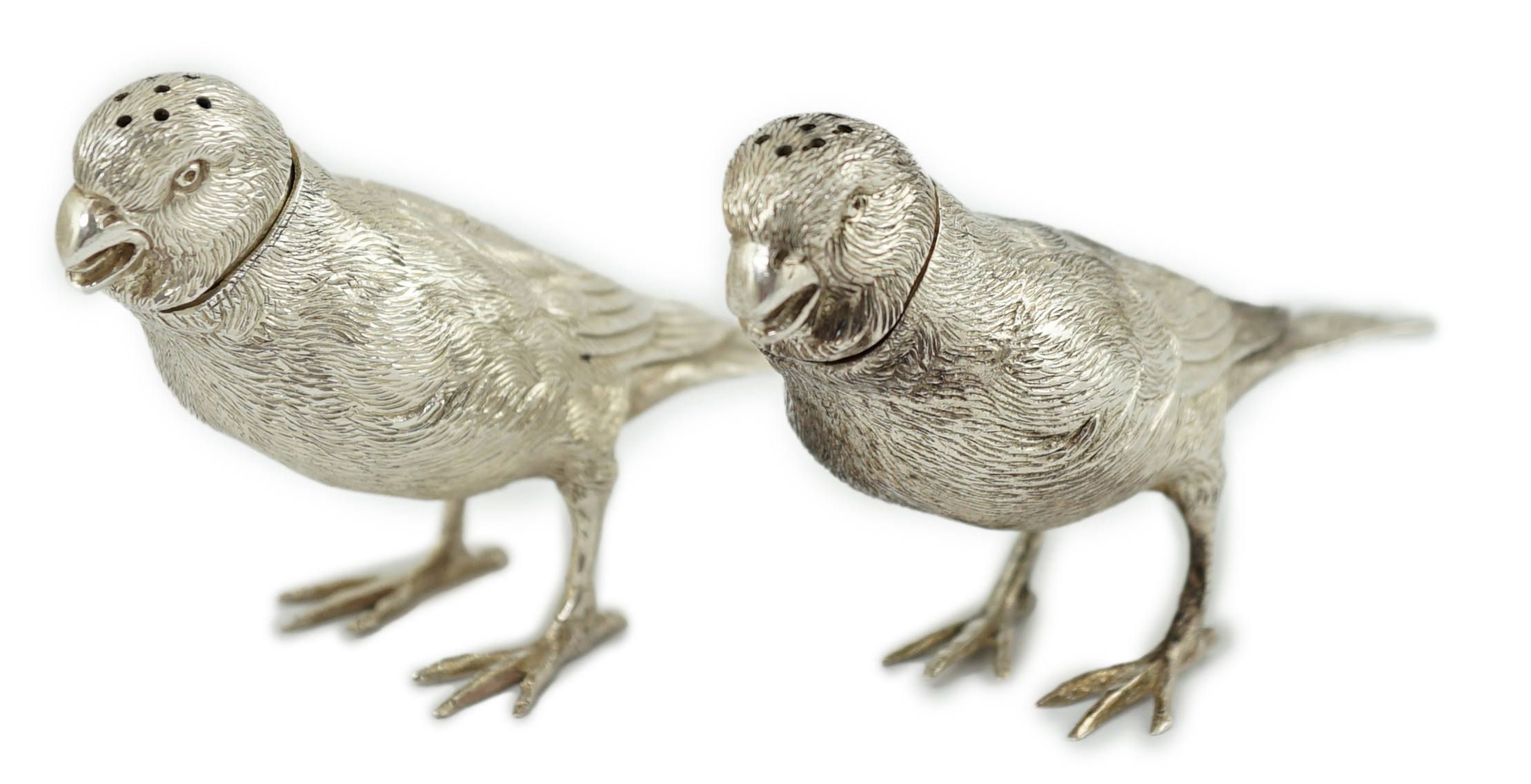 A pair of Elizabeth II silver novelty free-standing pepperettes, modelled as sparrows, by Israel Freeman & Son Ltd